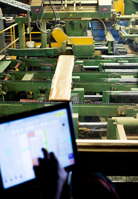 Operating the machinery at the Österbymo Hardwood sawmill.